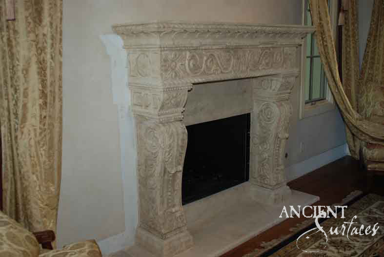 Detail of a reclaimed antique limestone mantel from Ancient Surfaces with an egg and floral carved frieze, rosette corbels and acanthus scrolled brackets