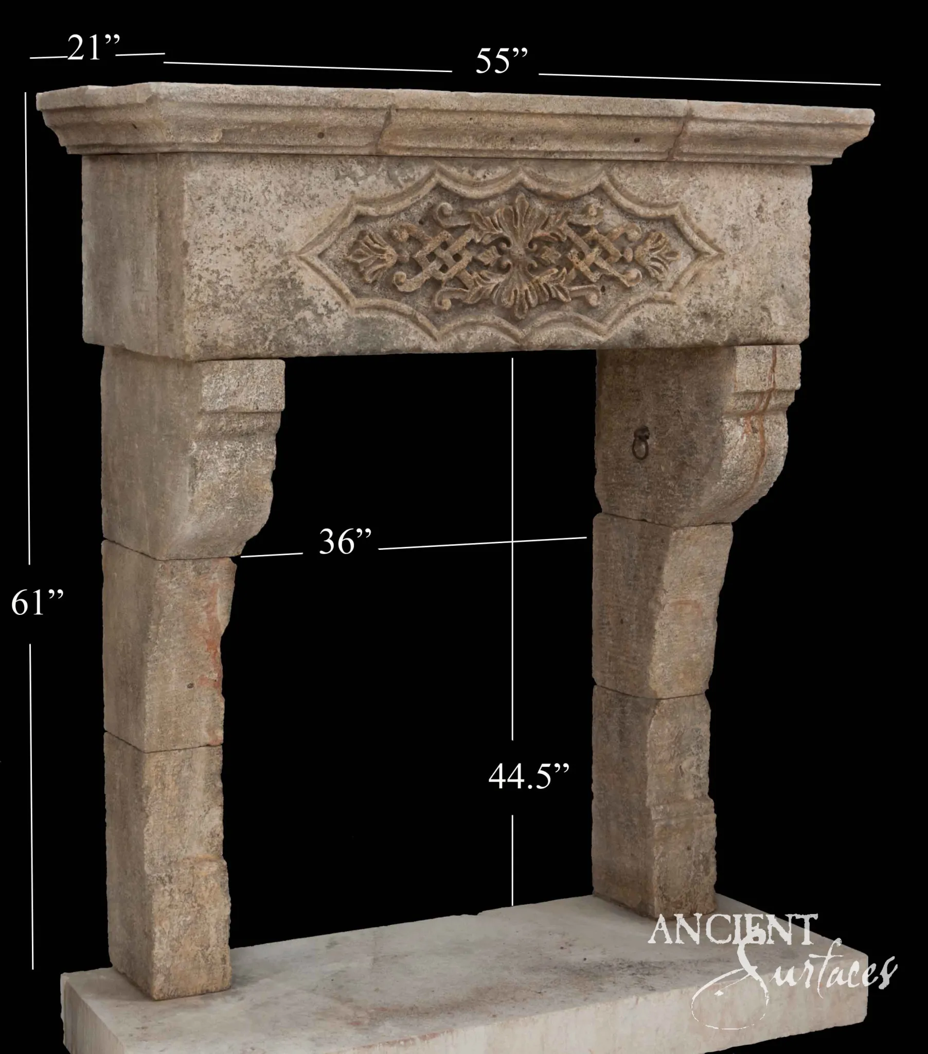 Reclaimed antique limestone mantel from Ancient Surfaces with a carved guilloche interlace frieze and a central fleur finial, photographed with dealer measurements marked